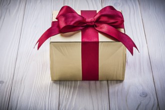 Birthday gift box on wooden board holidays concept