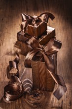 Set of giftboxes on old wooden board