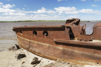 Rusty ship on the shore of Ob river in Russia