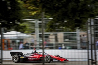 WILL POWER (12) of Toowoomba, Australia runs through the streets during the Honda Indy Toronto in