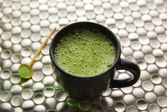 Matcha green tea from Japan on modern stainless steel background