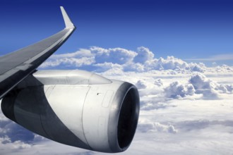 Airplane wing aircraft turbine flying blue sky white clouds