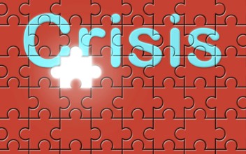 Crisis text written on a puzzle background with missing piece