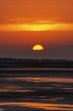 Beautiful golden coloured sunset at the seaside on the Isle Borkum