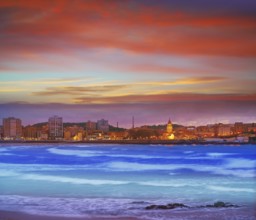 Gijon skyline sunset in San Lorenzo beach of Asturias in Spain
