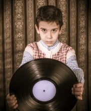 Child hold lp. Vontage clothes