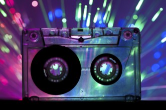 Transparent Cassette tape and blue pink color disco light background