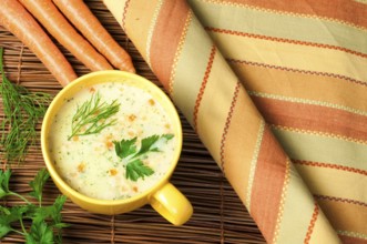 Chicken Cream Soup. Spoon and bread on the table