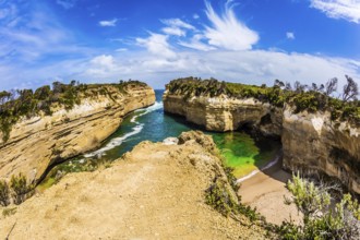 Small picturesque bay with green ocean water. The Great Ocean Road of Australia. The Pacific ocean.