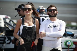 Bayley Currey walks pit road before qualifying for the Clean Harbors 250 in Richmond, VA, USA,