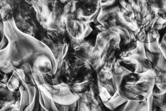 Abstract black smoke natural black smoke and white huge flame of strong fire. Dangerous firestorm