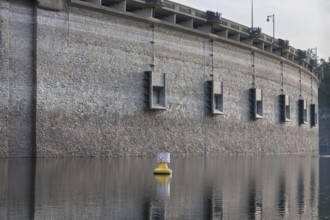 Edersee at low water level and a yellow buoy, Edertalsperre with medium drains