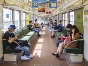 Kyoto, Japan - May 13 2019: People on a train near Sanjo Train Station in Kyoto, Japan, Asia
