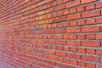 The background of the old red brick wall for design interior and various scenes or as a background