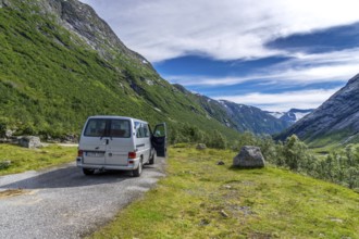 An idyllic valley in Strynefjell in Middle Norway in summertime with mountains and stream.A