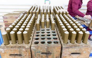 RPG explosive elements of anti tank rocket-propelled grenades (RPGs, bazooka) near an assembly line
