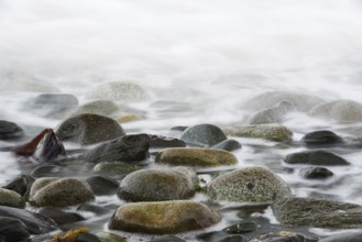 Returning ocean tide on a rocky coast on Quadra Island in Canada