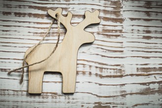 Vintage wooden deer string on wood board celebrations concept