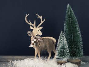 Christmas decoration wooden reindeer with fir trees