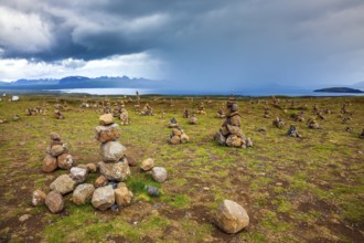 Stone pyramids bring good luck in the journey. The stone pyramids are a symbol of Iceland. Field of