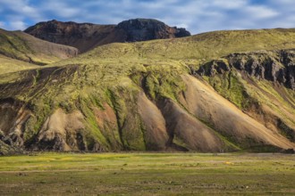 Multicolored rhyolite mountains surround the valley. Summer morning in the National Park