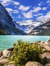 Glacial Lake Louise. Sunny fine day. Travel to the Rocky Mountains of Canada. The lake with azure