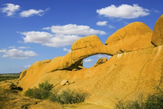 Mountain Nature Reserve in the desert. Stone arch Spitzkoppe, Namibia. The concept of extreme and