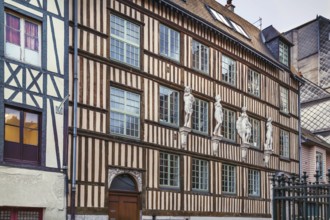 Historical half-timbered house with sculpture in Rouen, France, Europe