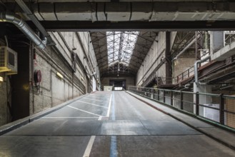 Brussels, Belgium, 05 23 2018: Industrial garage hall of the Kanal Centre Pompidou, now a museum,