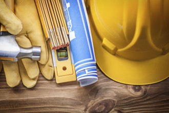Engineering drawing building helmet safety gloves claw hammer wooden meter construction level