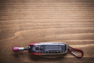 Replaceable screwdriver bits in toolbox on wooden board construction concept