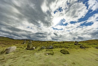 Druids Circle, stone circle in wide landscape with pastures in the mountains, Penmaenmawr,