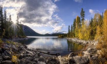 Beautiful autumn landscape scene in lake and mountain in background in west Canada