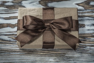 Brown present box on wooden background