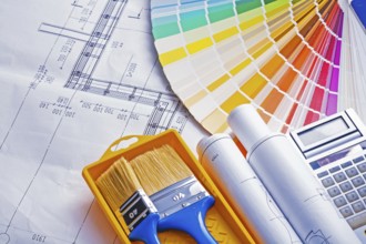 Set of painting tools paint brushes in tray rolls blueprints color palette calculator