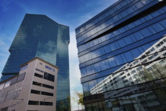 High-rise buildings with glass facades and sky in the background in urban style, Prime Tower,