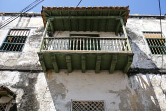 Low angle view of a green roofed balcony at an old house in Old Town Cartagena, Brazil, South