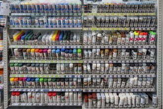 Shelf with spray paint cans in a DIY store, Allgäu, Swabia, Bavaria, Germany, Europe