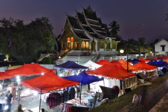 Night market in front of the Buddhist temple Haw Phra Bang of the Royal Palace, National Museum on