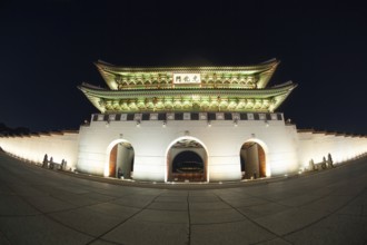 Wide angle shot of the illuminated Gwanghwamun Gate at night. Sightseeing of Seoul, South Korea,