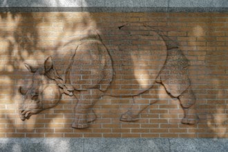 Berlin, Germany, 2014. Rhinoceros relief on the wall outside the zoo in Berlin, Europe