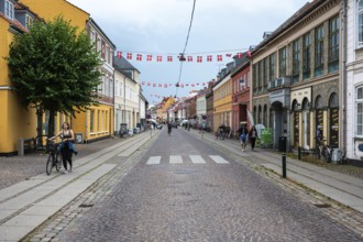 Koge, Seeland, Denmark, July 23, 2024 - Colorful historical houses at the main shopping street of