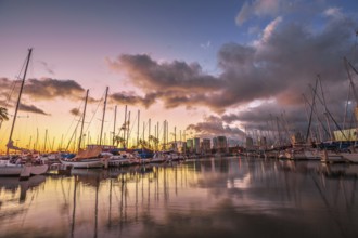 Dramatic landscape of sailing boats and yachts docked at the Ala Wai Harbor, the largest yacht