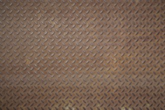 Front view of a rusty panel with non-slip surface