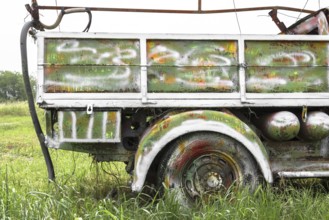An old abandoned pickup truck, painted with bright colors