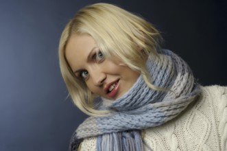 Pretty blonde girl in winter clothes with jumper, scarf and gloves, St. Petersburg, Russia, Europe