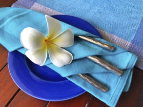Food decoration with white plumeria rubra flower, Sri Lanka. Blue food decoration