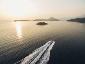 Motor boat sails to the Mamula fortress on the island. Kotor Bay.