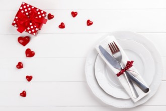 Romantic table setting on white wooden table.Valentine's day card template