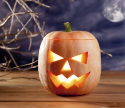 Halloween lantern pumpkin in dark sky clouds moonlight